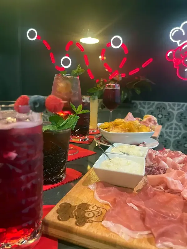 Cocktails, chips and a board of cured meats on my counter