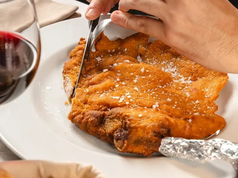 The Milanese col manico cut at the table, with bread